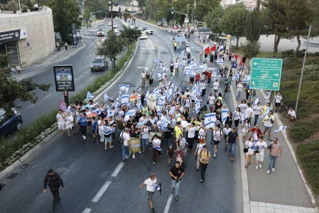 July 15, 2026, Jerusalem, Israel: JERUSALEM Ã¢â‚¬ JULY 15, 2026: Hundreds of teenagers and young adults march from Paris Square to the Knesset during a protest demanding equal military service obligations for all Israeli citizens, including the ultra-Orthodox community, in Jerusalem on July 15, 2026. Organized by the Hanaton Mechina in the Galilee, the demonstration was held in response to proposed legislation expanding military draft exemptions and suspending the arrest of draft evaders. Participants, including pre-military academy students, military service candidates and youth movement members, carried a symbolic stretcher before holding a rally outside the Knesset. Hilel Ben or JNA PRESS Jerusalem Israel  - ZUMAq101 20260715_zna_q101_204 Copyright: xHilelxBenxOrx