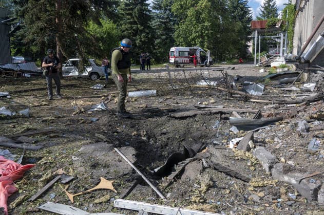Russian guided bomb strike damages industrial zone in Kharkiv KHARKIV, UKRAINE - JULY 15: The aftermath of a strike by a Russian guided aerial bomb is seen in an industrial zone in Kharkiv, Ukraine, on July 15, 2026. The attack caused severe damage to industrial buildings housing woodworking, footwear and clothing manufacturing facilities, as well as other civilian enterprises. Seven vehicles parked near the impact site were also damaged. According to local authorities, eight civilians were injured in the strike. Men aged 44, 49, 50 and 57, along with women aged 31, 51 and 60, were hospitalized with injuries of varying severity. A 51-year-old man who suffered cuts from shattered glass received medical treatment at the scene. Serhii Masin  Copyright: x2026xAnadoluxSerhiixMasinx