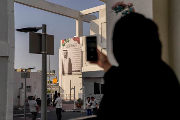 Injured People from Gaza hang portraits of the late Emir Sheikh Hamad bin Kha lifa Al Thani in Doha, Qatar -15 Jul 2026 A man seen recording people standing next to a portrait of the late Emir, Sheikh Hamad bin Khalifa Al Thani, on the building of the Al Thumama complex . Qatar has declared a four-day period of national mourning following the passing of the former Emir, Sheikh Hamad bin Khalifa Al Thani, at the age of 74. The former Emir—who assumed power in June 1995—is regarded as the principal architect of modern Qatar; he is renowned for transforming the Gulf state into an influential global power during a period marked by unprecedented economic development, expanding diplomatic influence, and rapid infrastructure growth. Injured indivi Copyright: xYousefxMasoudx xSOPAxImagesx Injured people from Gaza hang portraits of the late Emir Sheikh Hamad bin Khalifa Al Thani on th(7)