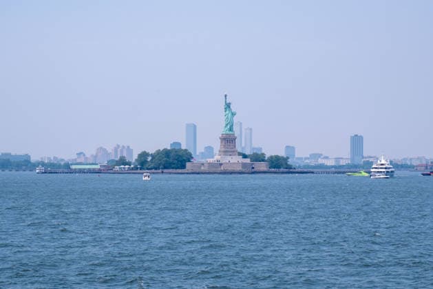 July 15, 2026, New York, New York, USA: Hazy view of The Statue of Liberty from the Staten Island Ferry as smoke from the Canadian wildfires moves over the city...Both heat and Air Quality Health Advisories are in effect New York City as smoke from Canadian wildfires coincide with temperatures expected to reach near100Ã‚Â°F as a heatwave continues. New York USA  - ZUMAp288 20260715_znp_p288_025 Copyright: xSyndixPilarx