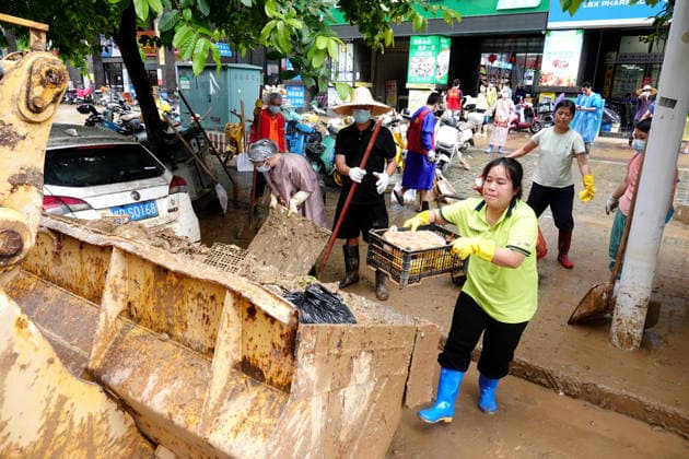 GUIGANG, CHINA - JULY 15: Residents clear silt and debris after floodwater recedes on July 15, 2026 in Guigang, Guangxi Zhuang Autonomous Region of China. Recent extreme rainstorms triggered by Typhoon Maysak, the 10th typhoon of the year, have caused severe flooding in parts of Guangxi in the Pearl River basin.  Copyright: xVCGx 111654558947
