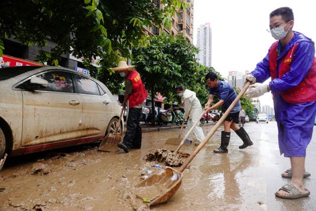 GUIGANG, CHINA - JULY 15: Residents clear silt and debris after floodwater recedes on July 15, 2026 in Guigang, Guangxi Zhuang Autonomous Region of China. Recent extreme rainstorms triggered by Typhoon Maysak, the 10th typhoon of the year, have caused severe flooding in parts of Guangxi in the Pearl River basin.  Copyright: xVCGx 111654558949