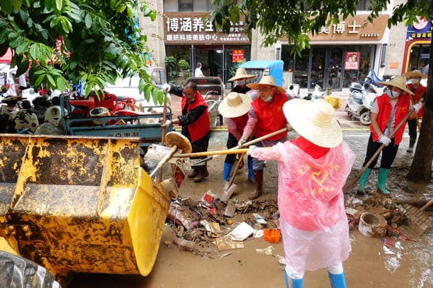 GUIGANG, CHINA - JULY 15: Residents clear silt and debris after floodwater recedes on July 15, 2026 in Guigang, Guangxi Zhuang Autonomous Region of China. Recent extreme rainstorms triggered by Typhoon Maysak, the 10th typhoon of the year, have caused severe flooding in parts of Guangxi in the Pearl River basin.  Copyright: xVCGx 111654558951