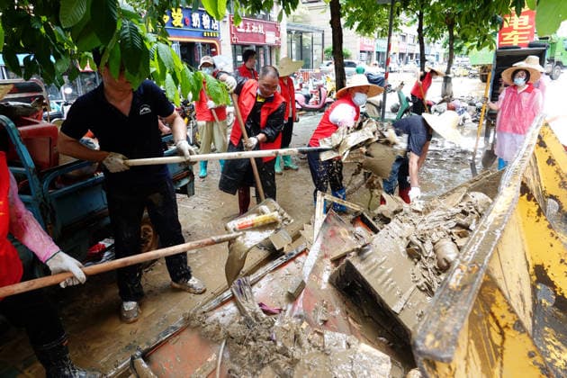 GUIGANG, CHINA - JULY 15: Residents clear silt and debris after floodwater recedes on July 15, 2026 in Guigang, Guangxi Zhuang Autonomous Region of China. Recent extreme rainstorms triggered by Typhoon Maysak, the 10th typhoon of the year, have caused severe flooding in parts of Guangxi in the Pearl River basin.  Copyright: xVCGx 111654558952