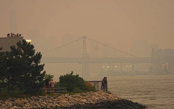 Canadian wildfire smoke returns to New York City NEW YORK CITY, UNITED STATES - JULY 15: Smoke from wildfires in Canada is causing poor air quality across New York City on Wednesday and could make it harder to breathe, especially for people with asthma or other health conditions, July 15, 2026, New York City, U.S. Selcuk Acar Anadolu New York United States. Editorial use only. Please get in touch for any other usage.  Copyright: x2026xAnadoluxSelcukxAcarx