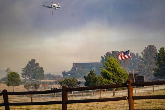 July 15, 2026, Boulevard, California, United States: Smoke and flame are seen along the road..The Thorn Fire burns near Buckthorn Trail and Clover Trail in the Boulevard Campo area of southeastern San Diego County on Wednesday, July 15, 2026. Fueled by hot, dry conditions, the wildfire spreads rapidly, prompts evacuation orders and warnings, temporarily closes portions of Interstate 8, and draws a large response from Cal Fire and local agencies. Firefighters on the ground, supported by air tankers and helicopters, work to slow the fire s advance and protect nearby homes and infrastructure as officials monitor changing fire conditions. Boulevard United States  - ZUMAs197 20260715_aaa_s197_317 Copyright: xWaixLeexMichaelxHox