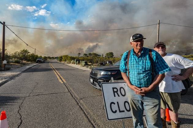 July 15, 2026, Boulevard, California, United States: Residents in the area watch the wildfire on the road..The Thorn Fire burns near Buckthorn Trail and Clover Trail in the Boulevard Campo area of southeastern San Diego County on Wednesday, July 15, 2026. Fueled by hot, dry conditions, the wildfire spreads rapidly, prompts evacuation orders and warnings, temporarily closes portions of Interstate 8, and draws a large response from Cal Fire and local agencies. Firefighters on the ground, supported by air tankers and helicopters, work to slow the fire s advance and protect nearby homes and infrastructure as officials monitor changing fire conditions. Boulevard United States  - ZUMAs197 20260715_aaa_s197_321 Copyright: xWaixLeexMichaelxHox