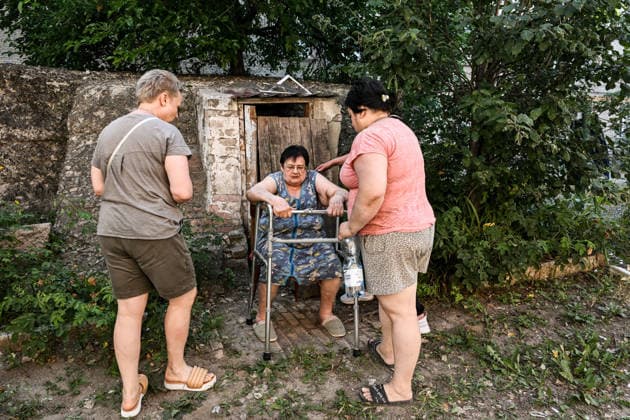Women stand by an elderly woman leaning on a walker after an evacuation from a three-storey apartment block damaged by a Russian airstrike due to the threat of collapse, Zaporizhzhia, Ukraine, July 15, 2026. The Russian army attacked the southeastern city with guided aerial bombs, killing three people and injuring at least 15 others. The strikes also damaged critical and civilian infrastructure. (Photo by Dmytro Smolienko Ukrinform) Russia launches another air strike on Zaporizhzhia  Copyright: xDmytroxSmolienkox