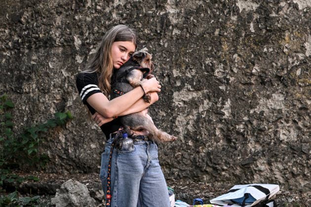 A woman evacuated from a three-storey apartment block damaged by a Russian airstrike due to the threat of collapse hugs a dog, Zaporizhzhia, Ukraine, July 15, 2026. The Russian army attacked the southeastern city with guided aerial bombs, killing three people and injuring at least 15 others. The strikes also damaged critical and civilian infrastructure. (Photo by Dmytro Smolienko Ukrinform) Russia launches another air strike on Zaporizhzhia  Copyright: xDmytroxSmolienkox