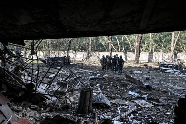 Law enforcers and rescuers work outside a three-storey apartment block damaged by a Russian airstrike, Zaporizhzhia, Ukraine, July 15, 2026. The Russian army attacked the southeastern city with guided aerial bombs, killing three people and injuring at least 15 others. The strikes also damaged critical and civilian infrastructure. (Photo by Dmytro Smolienko Ukrinform) Russia launches another air strike on Zaporizhzhia  Copyright: xDmytroxSmolienkox
