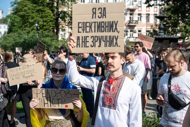 A demonstrator holds a placard reading I’m for Effective, Not Convenient during a rally against the dismissal of Ukrainian Defence Minister Mykhailo Fedorov, Kyiv, Ukraine, July 16, 2026. On July 14, the Ukrainian Parliament supported the resignation of Prime Minister Yuliia Svyrydenko, leading to the resignation of the Cabinet of Ministers. (Photo by Danylo Antoniuk Ukrinform) Protest action against dismissal of Ukrainian Defence Minister Mykhailo Fedorov in Kyiv  Copyright: xDanyloxAntoniukx