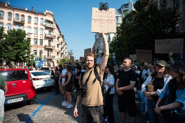 A demonstrator holds a placard with a drone reading Minister of Innovations Fedorov during a rally against the dismissal of Ukrainian Defence Minister Mykhailo Fedorov, Kyiv, Ukraine, July 16, 2026. On July 14, the Ukrainian Parliament supported the resignation of Prime Minister Yuliia Svyrydenko, leading to the resignation of the Cabinet of Ministers. (Photo by Danylo Antoniuk Ukrinform) Protest action against dismissal of Ukrainian Defence Minister Mykhailo Fedorov in Kyiv  Copyright: xDanyloxAntoniukx