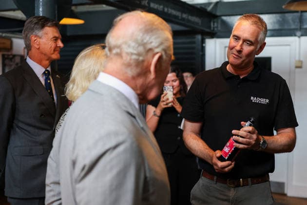 Britain s King Charles and Queen Camilla visits Blandford Forum in Dorset Head Brewer Toby Heasmann holds a King s bottle of beer as he talks with Britain s King Charlesat the Hall and Woodhouse Badger Brewery bar as the brewery celebrates its 250th anniversary in Blandford Forum, Dorset, Britain, July 16, 2026., Credit:Avalon.red PA ROTA - B68 Avalon UNITED KINGDOM, Dorset  Copyright: xAvalon.redx xPAxROTAx-xB68x xAvalonx 1116846069