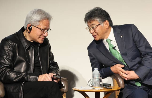 July 16, 2026, Tokyo, Japan - American AI chip maker Nvidia founfer and CEO Jensen Huang (L) chats with Japanese computer giant Fujitsu president Takahito Tokita (R) at a press conference as Japanese three robotics companies, Fanuc, Yaskawa Electric and Kawasaki Heavy Industries begin business collaboration with Nvidia and Fujitsu in the field of the physical AI in Tokyo on Thursday, July 16, 2026. (photo by Yoshio Tsunoda AFLO)  aflo_338196860