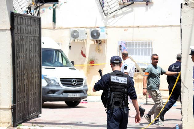 (260716) -- ALGIERS, July 16, 2026 -- Police officers stand guard after a fire ravaged an orphanage in Algiers, Algeria, on July 16, 2026. Eleven children were killed and 19 others injured in a fire that broke out Thursday morning at an orphanage in the Algerian capital Algiers, authorities said in a report. (Photo by Xinhua) (SpotNews) ALGERIA-ALGIERS-ORPHANAGE-FIRE BillelxBensalem 