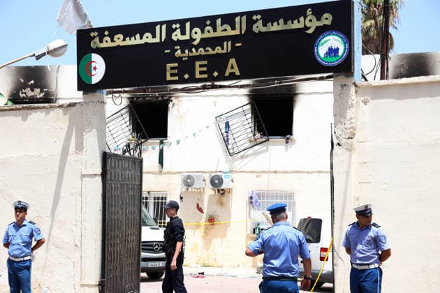 (260716) -- ALGIERS, July 16, 2026 -- Police officers stand guard after a fire ravaged an orphanage in Algiers, Algeria, on July 16, 2026. Eleven children were killed and 19 others injured in a fire that broke out Thursday morning at an orphanage in the Algerian capital Algiers, authorities said in a report. (Photo by Xinhua) (SpotNews) ALGERIA-ALGIERS-ORPHANAGE-FIRE BillelxBensalem 