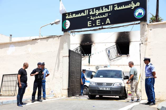(260716) -- ALGIERS, July 16, 2026 -- Police officers stand guard after a fire ravaged an orphanage in Algiers, Algeria, on July 16, 2026. Eleven children were killed and 19 others injured in a fire that broke out Thursday morning at an orphanage in the Algerian capital Algiers, authorities said in a report. (Photo by Xinhua) (SpotNews) ALGERIA-ALGIERS-ORPHANAGE-FIRE BillelxBensalem 