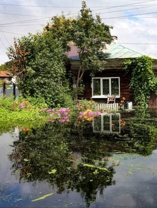 Russia Floods 9206501 16.07.2026 A view shows a flooded house after heavy rains caused rivers to rise in the Irbitsky District of Sverdlovsk Region, Russia. Irina Semenova Sputnik Sverdlovsk Oblast Region Russia  Copyright: xIrinaxSemenovax