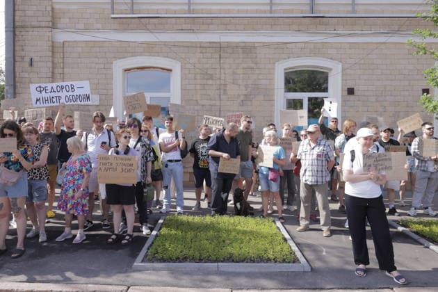 Anti-War Protesters Gather - Kharkiv Approximately 500 young people assembled outside a government building in Kharkiv on July 16, 2026, to protest the dismissal of Defense Minister Mikhail Fedorov. Demonstrators held handmade cardboard signs with messages in Ukrainian, expressing opposition to the ministerial change. The protest took place in front of a brick administrative building with arched windows in central Kharkiv. Photo by Titov Yevhen ABACAPRESS.COM Kharkiv Kharkiv Oblast Ukraine  Copyright: xTitovxYevhen ABACAx