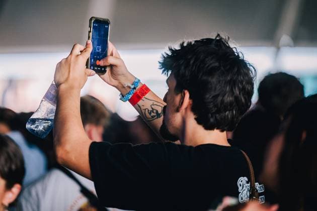 Festival visitor doing videos pictured during the second day of the Dour festival in Dour, on Wednesday 15 July 2026. The festival takes place from 15 to 19 July.  EMILExWINDAL 181275260