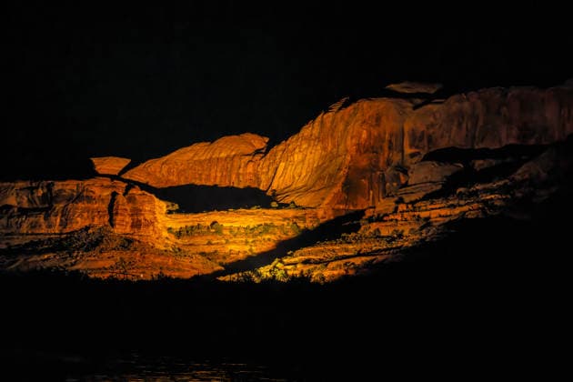 Creative Highlights World Spot-lighted cliffs along the Colorado River during a Canyonlands by Night tour in Moab, Utah. Moab Colorado River Utah United States Copyright: xJonxG.xFullerx xVWPicsx 5222-JGF-Canyonlands-by-Night-US-UT