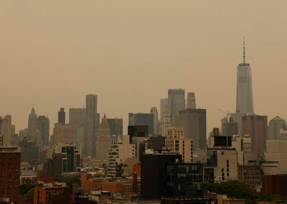 Smoke from wildfires in Canada drop hazy skies on the Manhattan skyline in the mid morning on Thursday, July 16, 2026 in New York City. All of New York State, including New York City, and parts of New Jersey are under an Air Quality Advisory due to the smoke from more than 100 wildfires burning in Canada.  NYP202607161002 JOHNxANGELILLO