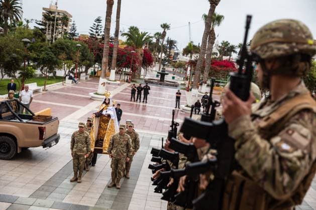 July 16, 2026, Arica, Chile: ARICA, CHILE Ã¢â‚¬ JULY 2026: Chilean soldiers carry an image of the Virgen del Carmen from the foot of the steps into San Marcos Cathedral, where it will remain for worshippers to venerate over the following days, while a Catholic priest looks on. This year marks 100 years since the Church crowned the Virgen del Carmen, Patroness of Chile. Ibar Silva JNA Press. Arica Chile - ZUMAq101 20260716_zna_q101_058 Copyright: xIbarxFelipexSilvaxCanalesx