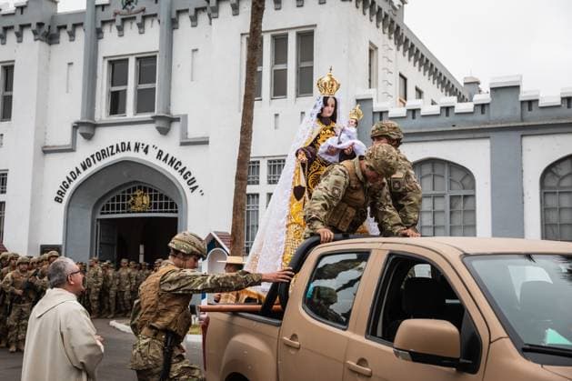July 16, 2026, Arica, Chile: ARICA, CHILE Ã¢â‚¬ JULY 2026: Chilean soldiers carry an image of the Virgen del Carmen from the foot of the steps into San Marcos Cathedral, where it will remain for worshippers to venerate over the following days, while a Catholic priest looks on. This year marks 100 years since the Church crowned the Virgen del Carmen, Patroness of Chile. Ibar Silva JNA Press. Arica Chile - ZUMAq101 20260716_zna_q101_062 Copyright: xIbarxFelipexSilvaxCanalesx