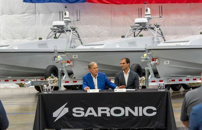 July 16, 2026, Austin, Tx, USA: Texas Governor GREG ABBOTT announces with Saronic CEO DINO MAVROOKAS the expansion to south Texas of the ship and drone boat manufacturer Saronic to a 1,000 acre site at the Port of Brownsville. The Saronic Corsair in the background were the type of drones used to rescue downed U.S. pilots in the Gulf of Oman and attack naval facilities in Iraq. Austin USA - ZUMAd150 20260716_znp_d150_009 Copyright: xBobxDaemmrichx