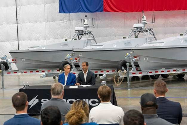July 16, 2026, Austin, Tx, USA: Texas Governor GREG ABBOTT announces with Saronic CEO DINO MAVROOKAS the expansion to south Texas of the ship and drone boat manufacturer Saronic to a 1,000 acre site at the Port of Brownsville. The Saronic Corsair in the background were the type of drones used to rescue downed U.S. pilots in the Gulf of Oman and attack naval facilities in Iraq. Austin USA - ZUMAd150 20260716_znp_d150_008 Copyright: xBobxDaemmrichx