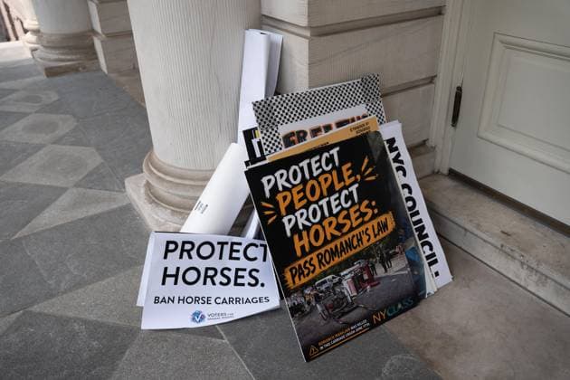 July 16, 2026, New York, New York, USA: The City Council held a hearing to consider a bill, known as RomanchÃ¢â‚¬â ¢s Law, that would phase out and eventually ban horse-drawn carriages. Signs are prohibited in New York City Hall, and after a morning rally signs were left outside the building....The bill is named after the 18-year-old tourist from India who was killed last month when he was thrown from a runaway carriage in Central Park after the horse was spooked. New York USA - ZUMAs142 20260716_fap_s142_023 Copyright: xNancyxSieselx