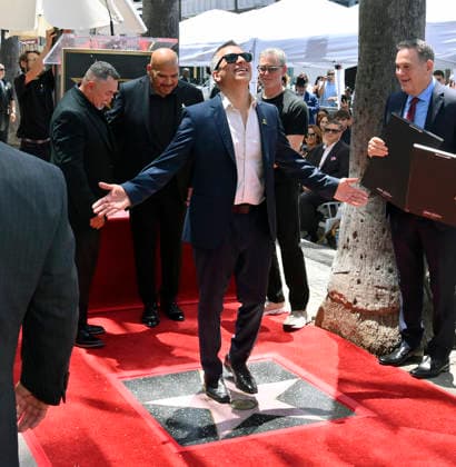 Intocable band member Alejandro Gulmar stands on the band s star during their Hollywood Walk of Fame star ceremony honoring the band with the 2,852nd star on the Hollywood Walk of Fame in Los Angeles on Thursday, July 16, 2026.  LAP2026071610 JIMxRUYMEN