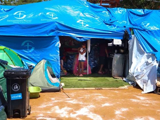 International Aid Camps Established for Displaced Families in La Guaira LA GUAIRA, VENEZUELA JULY 17, 2026: Relief workers and local volunteers set up temporary international aid camps, including tents provided by Türkiye s Disaster and Emergency Management Authority (AFAD), in open fields, sports facilities, and public parking areas in La Guaira, Venezuela, July 17, 2026. The camps are being established to accommodate the continued arrival of displaced families following the recent emergency. La Guaira Venezuela (Bolivarian Republic of) Copyright: x xMarioxFloresx xJNAxPressx