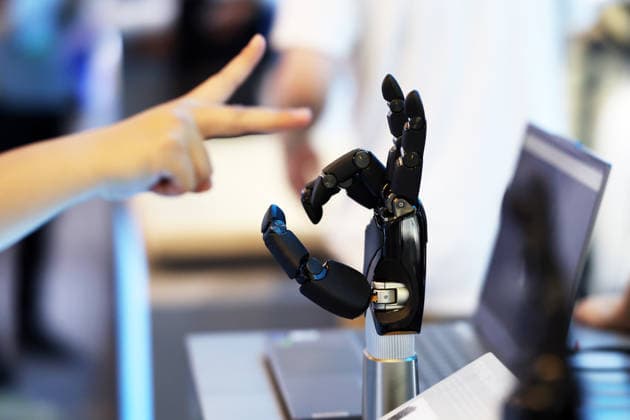 SHANGHAI, CHINA - JULY 17: A visitor experiences a robotic hand s gesture recognition function during the 2026 World AI Conference and High-Level Meeting on Global AI Governance on July 17, 2026 in Shanghai, China. Themed AI Partnership for a Brighter Future, the event will include more than 140 forums, bringing together 1,400 guests from home and abroad.  Copyright: xChinaxNewsxServicex 111654825212