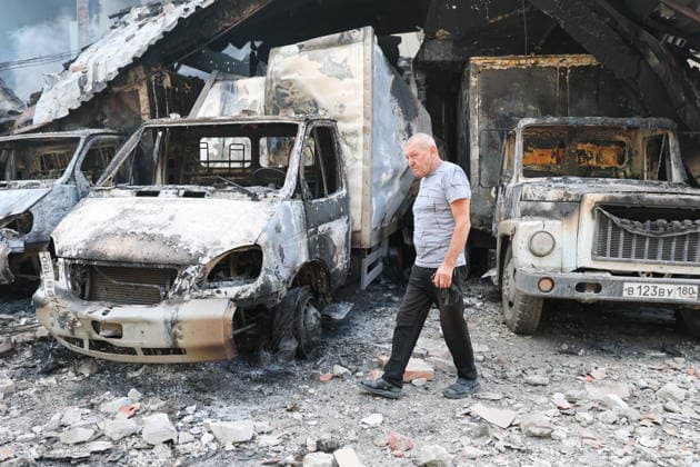 RUSSIA, GORLOVKA - JULY 17, 2026: A man reviews damage to vehicles at a warehouse building at Diad Confectionery Factory after a Ukrainian military strike. Dmitry Yagodkin TASS  95132516