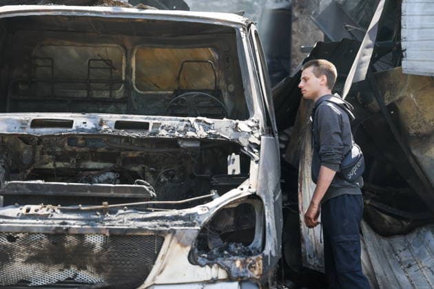 RUSSIA, GORLOVKA - JULY 17, 2026: A man reviews damage to vehicles at a warehouse building at Diad Confectionery Factory after a Ukrainian military strike. Dmitry Yagodkin TASS  95132514