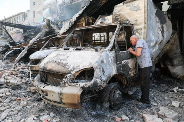 RUSSIA, GORLOVKA - JULY 17, 2026: A man reviews damage to vehicles at a warehouse building at Diad Confectionery Factory after a Ukrainian military strike. Dmitry Yagodkin TASS  95132515