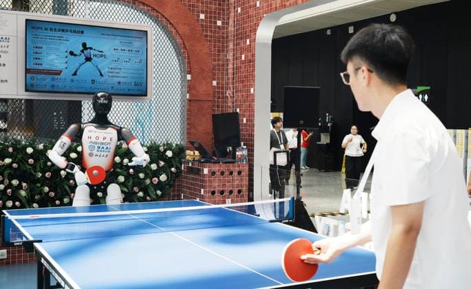 2026 WAIC Held in Shanghai SHANGHAI, CHINA - JULY 17, 2026 - An intelligent humanoid robot competed in a table tennis match with the audience at the 2026 World Artificial Intelligence Conference in Shanghai, China on July 17, 2026. Shanghai Shanghai China  Copyright: xCFOTOx i1784302541697