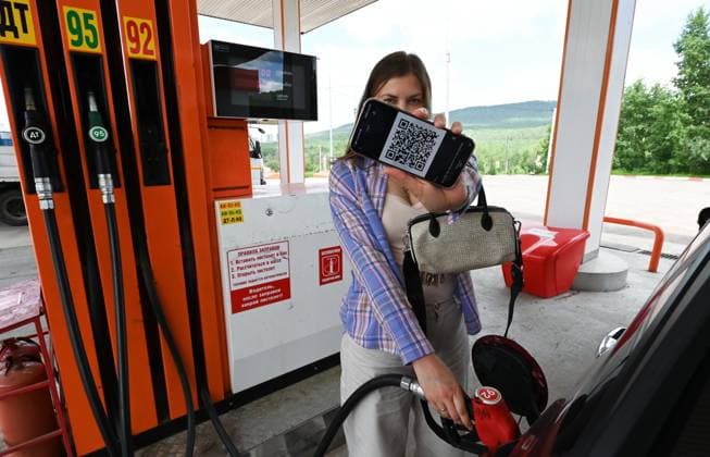 Russia Gasoline Shortages 9206764 17.07.2026 A driver uses a QR code to refuel a car at a petrol station amid gasoline shortages in Chita, Trans-Baikal Territory, Russia. Local authorities have begun testing QR code fuel purchases through the Max messenger app. Evgeny Yepanchintsev Sputnik Chita Russia  Copyright: xEvgenyxYepanchintsevx