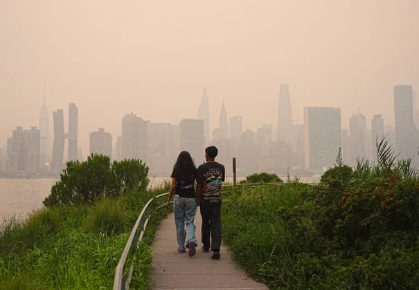 Wildfire smoke from Canada shrouds New York City skyline NEW YORK CITY, UNITED STATES - JULY 16: Smoke from massive wildfires in Canada engulfed the New York City skyline, reducing visibility and casting an orange haze over the New York City, United States on July 16, 2026. The smoky conditions reduced visibility across the skyline, while authorities continued monitoring air quality as the wildfire smoke spread across the northeastern United States. Selcuk Acar Anadolu New York United States. Editorial use only. Please get in touch for any other usage.  Copyright: x2026xAnadoluxSelcukxAcarx