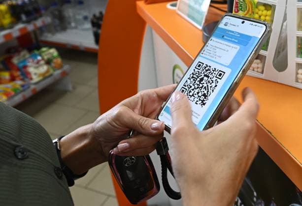Russia Gasoline Shortages 9206751 17.07.2026 A woman uses a QR code to refuel her car at a petrol station amid gasoline shortages in Chita, Trans-Baikal Territory, Russia. Local authorities have begun testing QR codes to enable fuel purchases through the Max messenger app. Evgeny Yepanchintsev Sputnik Chita Russia  Copyright: xEvgenyxYepanchintsevx