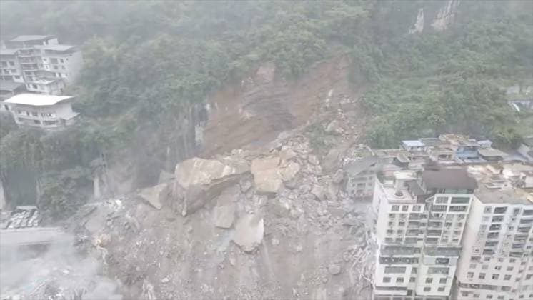 RECORD DATE NOT STATED 270762.jpg Drone image of a massive landslide caused multiple buildings to collapse near the Wujiang Three Bridges in Pengshui, Chongqing, China, on Friday July 17, 2026. State media says a landslide in the southwestern Chinese city of Chongqing has buried some residential buildings, trapping an undetermined number of people. A landslide Friday in the southwestern Chinese city of Chongqing buried some residential buildings, trapping an undetermined number of people, state media reported. State broadcaster CCTV said at least eight people were rescued from the debris, and that search and rescue operations were ongoing. CCTV said the landslide occurred at around 9:08 a.m. in Chongqing EDITORIAL USE ONLY  Copyright: xx 270762 x eyepress127276