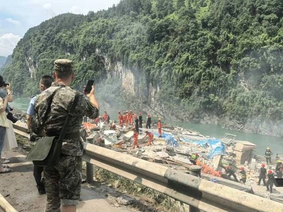 RECORD DATE NOT STATED 270761.jpg Rescue in the aftermath of a massive landslide caused multiple buildings to collapse near the Wujiang Three Bridges in Pengshui, Chongqing, China, on Friday July 17, 2026. State media says a landslide in the southwestern Chinese city of Chongqing has buried some residential buildings, trapping an undetermined number of people. A landslide Friday in the southwestern Chinese city of Chongqing buried some residential buildings, trapping an undetermined number of people, state media reported. State broadcaster CCTV said at least eight people were rescued from the debris, and that search and rescue operations were ongoing. CCTV said the landslide occurred at around 9:08 a.m. in Chongqing EDITORIAL USE ONLY  Copyright: xx 270761 x eyepress127277