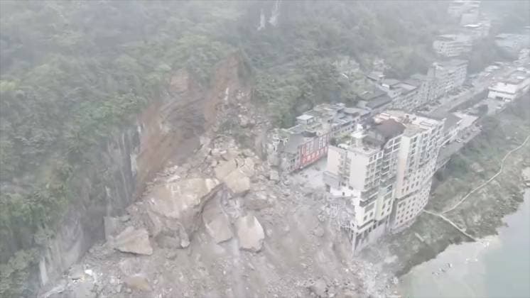 RECORD DATE NOT STATED 270763.jpg Drone image of a massive landslide caused multiple buildings to collapse near the Wujiang Three Bridges in Pengshui, Chongqing, China, on Friday July 17, 2026. State media says a landslide in the southwestern Chinese city of Chongqing has buried some residential buildings, trapping an undetermined number of people. A landslide Friday in the southwestern Chinese city of Chongqing buried some residential buildings, trapping an undetermined number of people, state media reported. State broadcaster CCTV said at least eight people were rescued from the debris, and that search and rescue operations were ongoing. CCTV said the landslide occurred at around 9:08 a.m. in Chongqing EDITORIAL USE ONLY  Copyright: xx 270763 x eyepress127282