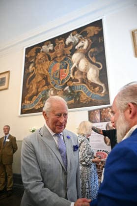 Charles and Camilla visit Blandford Forum Britain s King Charles III (C) is welcomed as he arrives to view the newly restored George II Royal Coat of Arms (behind) during a visit to the recently renovated historic Town Hall and Corn Exchange, built in 1734, in Blandford Forum, Dorset, south-west England on July 16, 2026., Credit:JUSTIN TALLIS PA ROTA - B68 Avalon United Kingdom, Dorset, Blandford Forum  Copyright: xJUSTINxTALLISx xPAxROTAx-xB68x xAvalonx 1117025649
