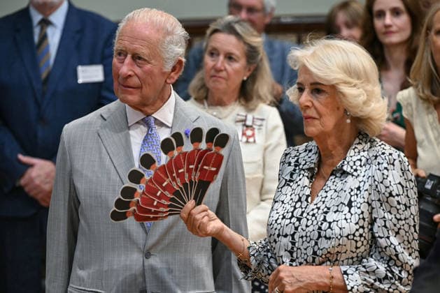 Charles and Camilla visit Blandford Forum Britain s Queen Camilla (R) fans Britain s King Charles III (L) as they listen to a performance of Dorset Opera, during a visit to the Main Hall at the Blandford Forum Town Hall and Corn Exchange in Blandford Forum, Dorset, south-west England on July 16, 2026., Credit:JUSTIN TALLIS PA ROTA - B68 Avalon United Kingdom, Dorset, Blandford Forum  Copyright: xJUSTINxTALLISx xPAxROTAx-xB68x xAvalonx 1117025671