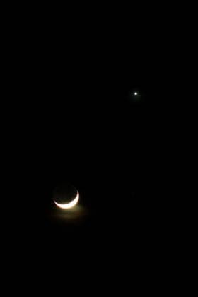 July 17, 2026, Aceh Besar, Aceh, Indonesia: A crescent moon shines adjacent to Venus in the sky over Meunasah Moncut, Lhoknga, Aceh Besar Regency, Aceh Province, Indonesia, on Friday, July 17, 2026. In astronomy, a conjunction occurs when two celestial bodies appear close to each other from Earth s perspective. Aceh Besar Indonesia - ZUMAs340 20260717_zip_s340_004 Copyright: xKhairuxSyukrillahx