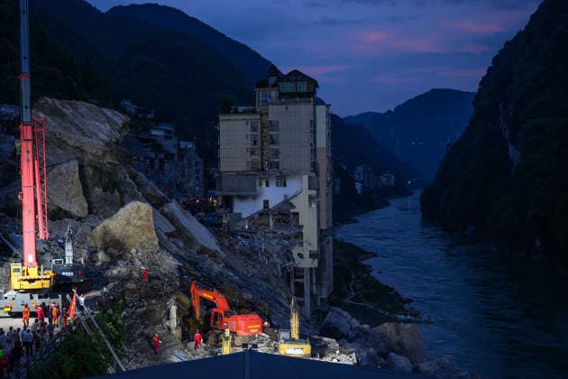 CHONGQING, CHINA - JULY 17: Rescue workers conduct night search operations at the site of a landslide in Hanxia Street along the Wujiang River on July 17, 2026 in Pengshui, Chongqing Municipality of China. A landslide occurred around 9:00 a.m. local time, burying several residential buildings and trapping people; emergency and fire departments are conducting rescue operations with local authorities.  Copyright: xChinaxNewsxServicex 111654894952