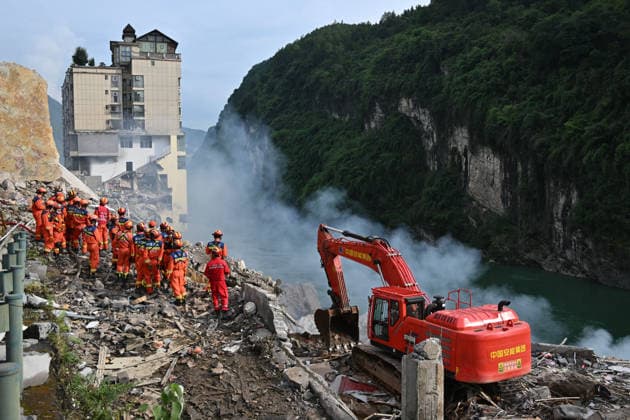 CHONGQING, CHINA - JULY 17: Rescue workers search for survivors at the site of a landslide in Hanjia Street along the Wujiang River on July 17, 2026 in Pengshui, Chongqing Municipality of China. Multiple residential buildings were buried and people were trapped after the landslide occurred around 9:00 am local time; emergency and fire departments are conducting rescue operations.  Copyright: xChinaxNewsxServicex 111654894964