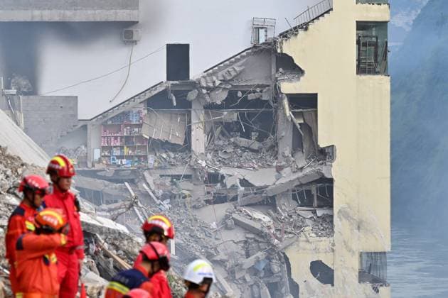 CHONGQING, CHINA - JULY 17: Rescue workers search for survivors at the site of a landslide in Hanxia Street along the Wujiang River on July 17, 2026 in Pengshui Miao and Tujia Autonomous County, Chongqing Municipality of China. A landslide occurred around 9:00 am local time, burying several residential buildings and trapping people, while emergency and fire departments have joined local authorities to carry out rescue operations.  Copyright: xChinaxNewsxServicex 111654894980